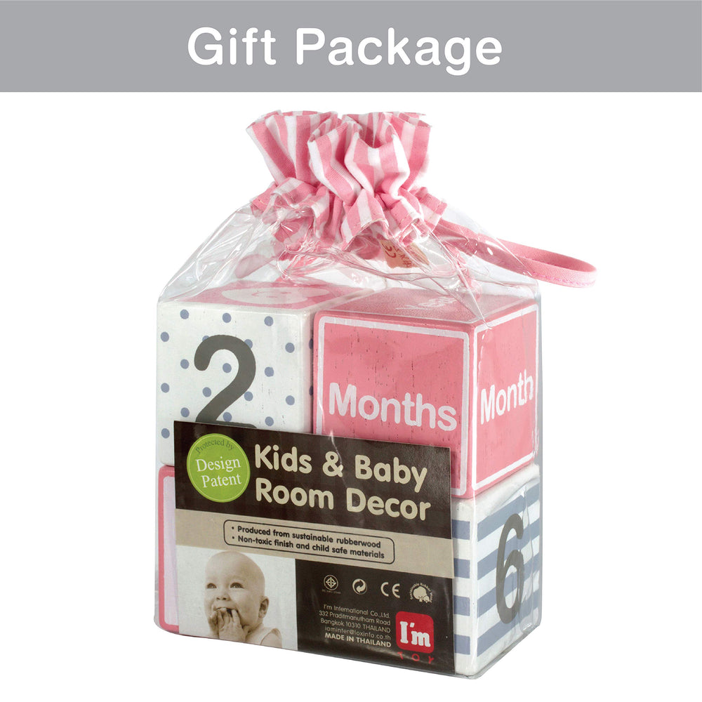 I'm solid wood blocks pink gift packaging ready for a baby shower.