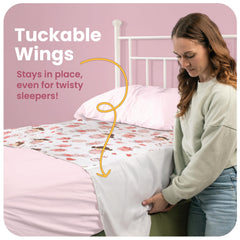 IMPROVIA pad with tuckable wings in use shows secure fit under mattress.
