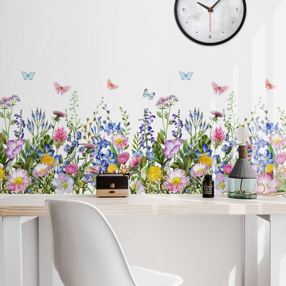 Incholl colorful blooms with butterfly accents create a calming nursery atmosphere.