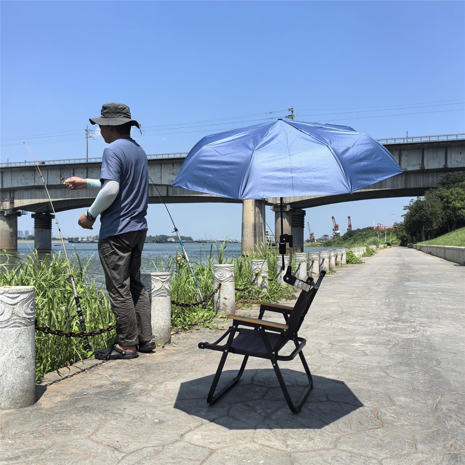 Inf-way umbrella holder in use on a chair provides shaded comfort.