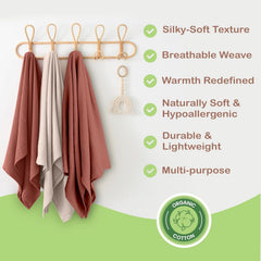 Infancie muslin blanket in nursery rust ivory—cozy, calming ambiance for baby's space.