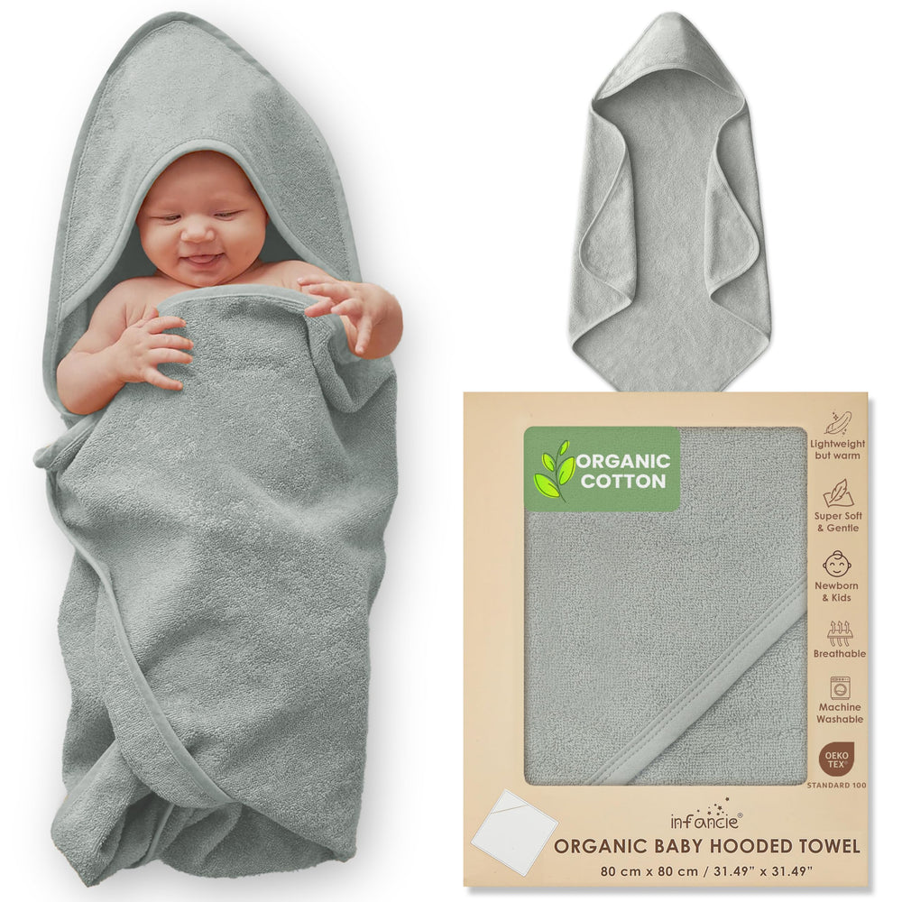 Infancie hooded towel folded in moss green shows plush softness after bath.