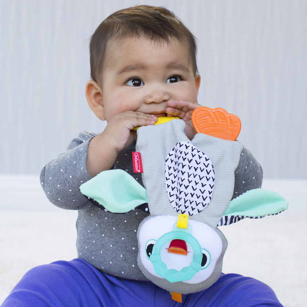 Infantino Cuddly Teether penguin crinkle texture engages baby with sound.