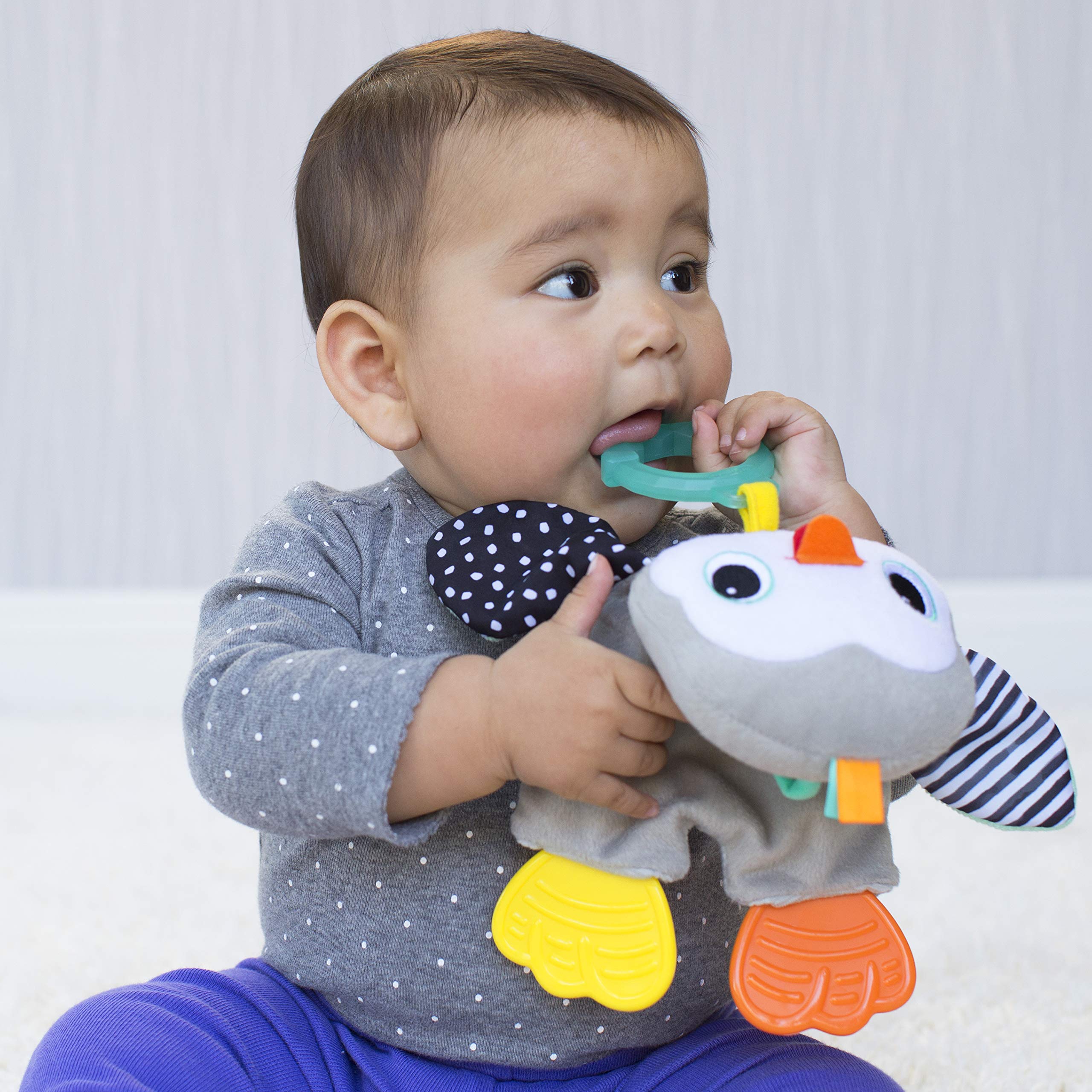 Infantino Cuddly Teether penguin soft fabric textures for gentle sensory play.