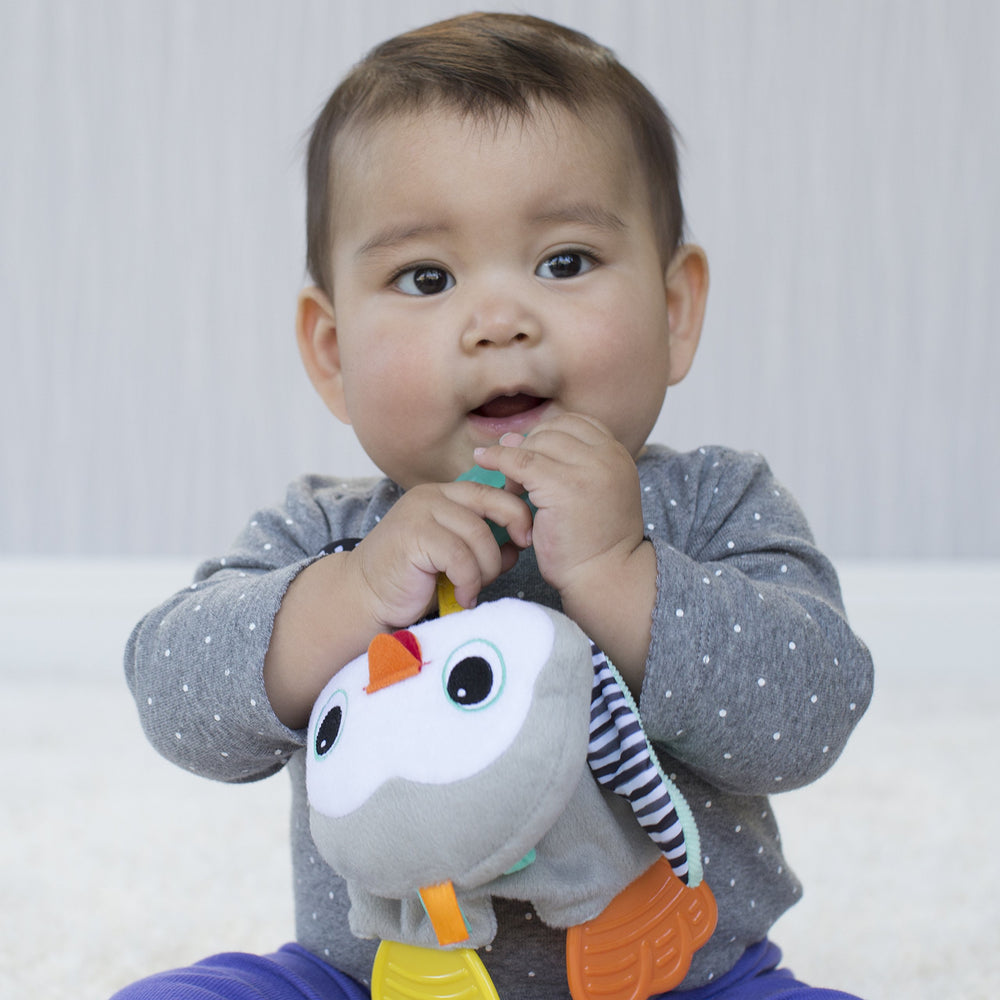 Infantino Cuddly Teether penguin textured teether close-up for tactile exploration.