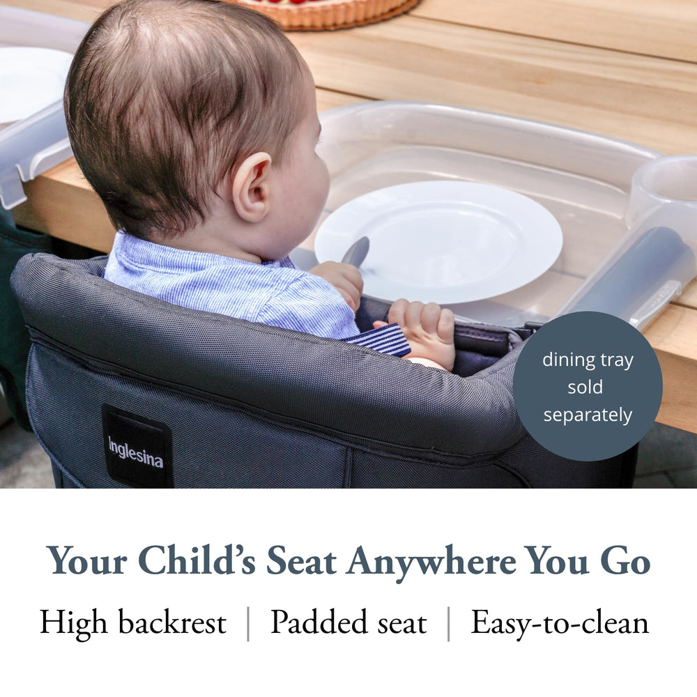 Inglesina Fast Table Chair attached to a table for safe feeding at meals.
