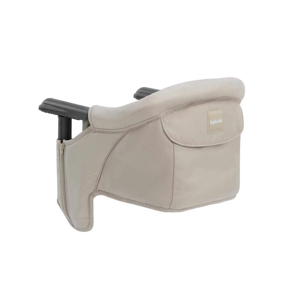Inglesina Fast Table Chair cream with collapsible design for convenient dining on the go.