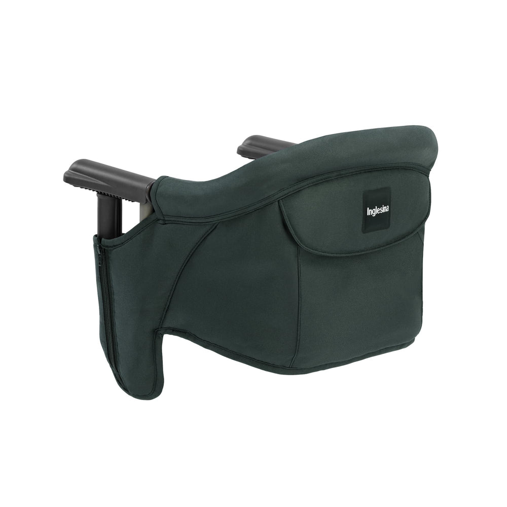 Inglesina Fast Table Chair in dark green, folded compactly for travel and storage.