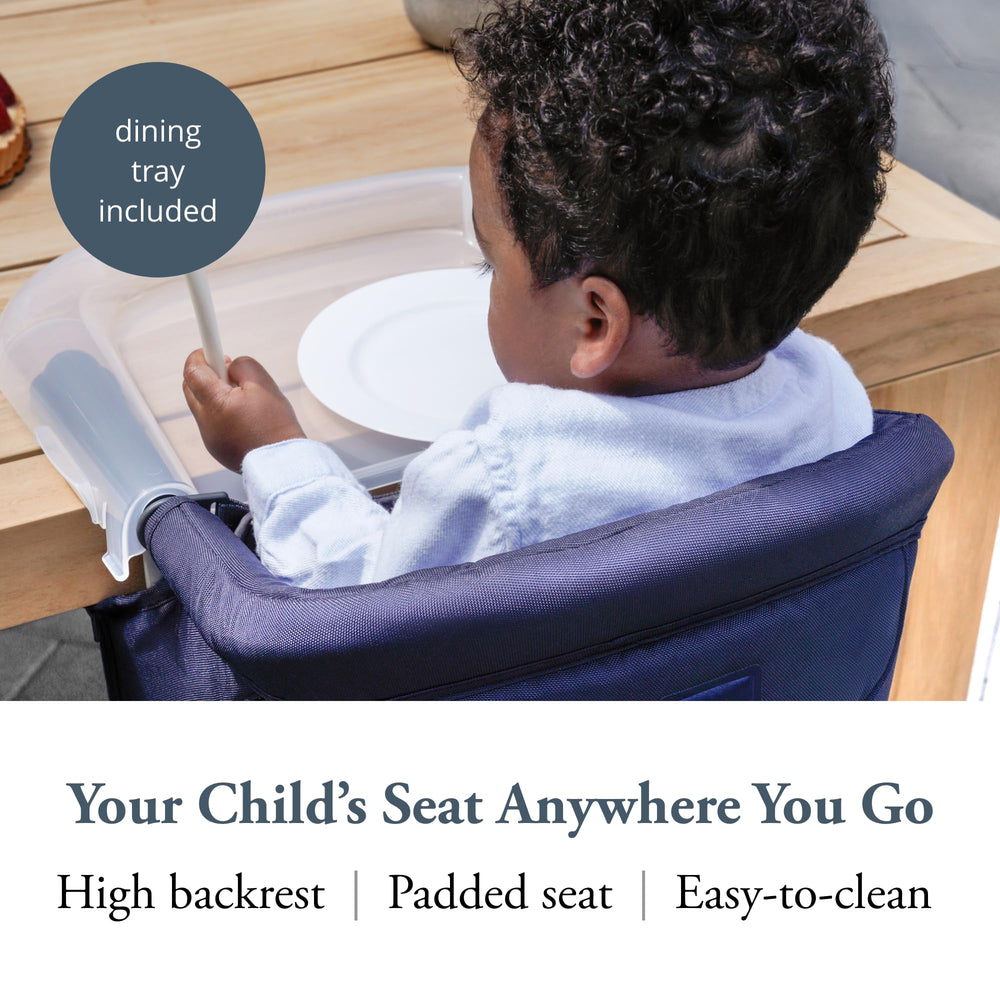 Inglesina Fast Table Chair navy folded demonstrates compact, portable design for travel.