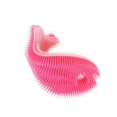 Innobaby Bathin' Smart silicone fish pink in hand for a gentle, calming bath-time massage.