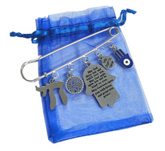 InspiJ safety pin close-up showing the Chai life charm symbolizing life.