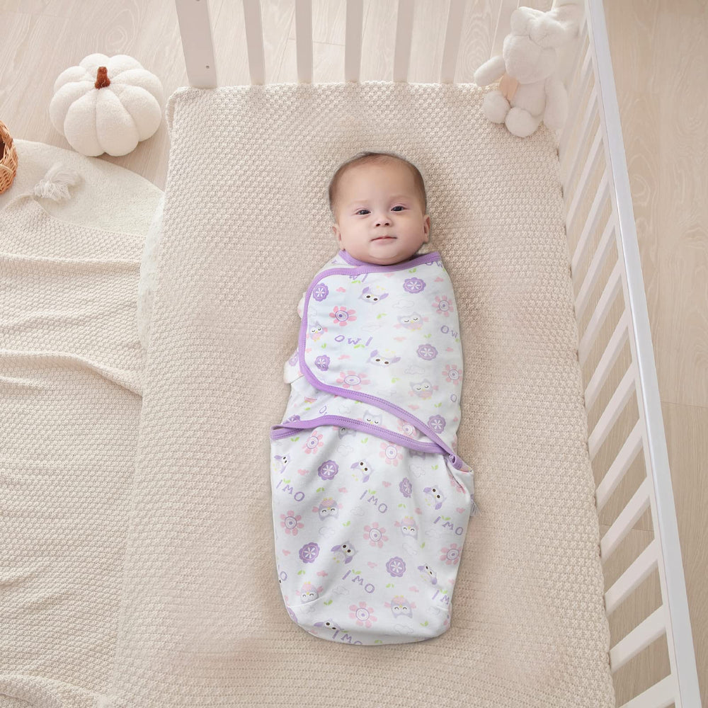 Insular swaddle owl design closeup highlights soft cotton fabric and secure Velcro for easy adjustments.