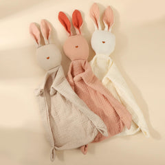 Insular Bunny Lovey Blanket beige held at bedtime for soothing comfort.