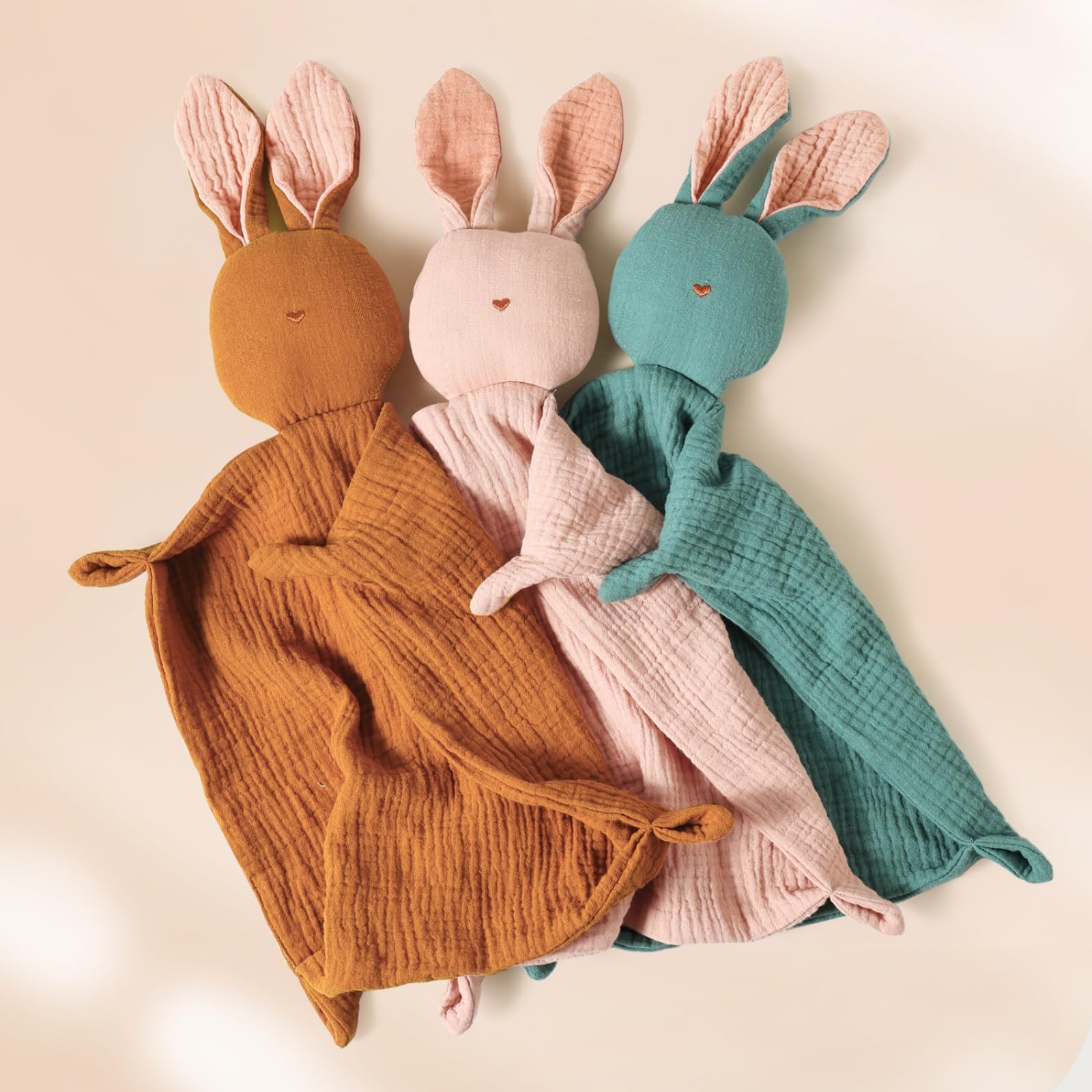 Insular Bunny Lovey close-up shows embroidered nose and four-layer muslin texture for gentle sensory comfort.