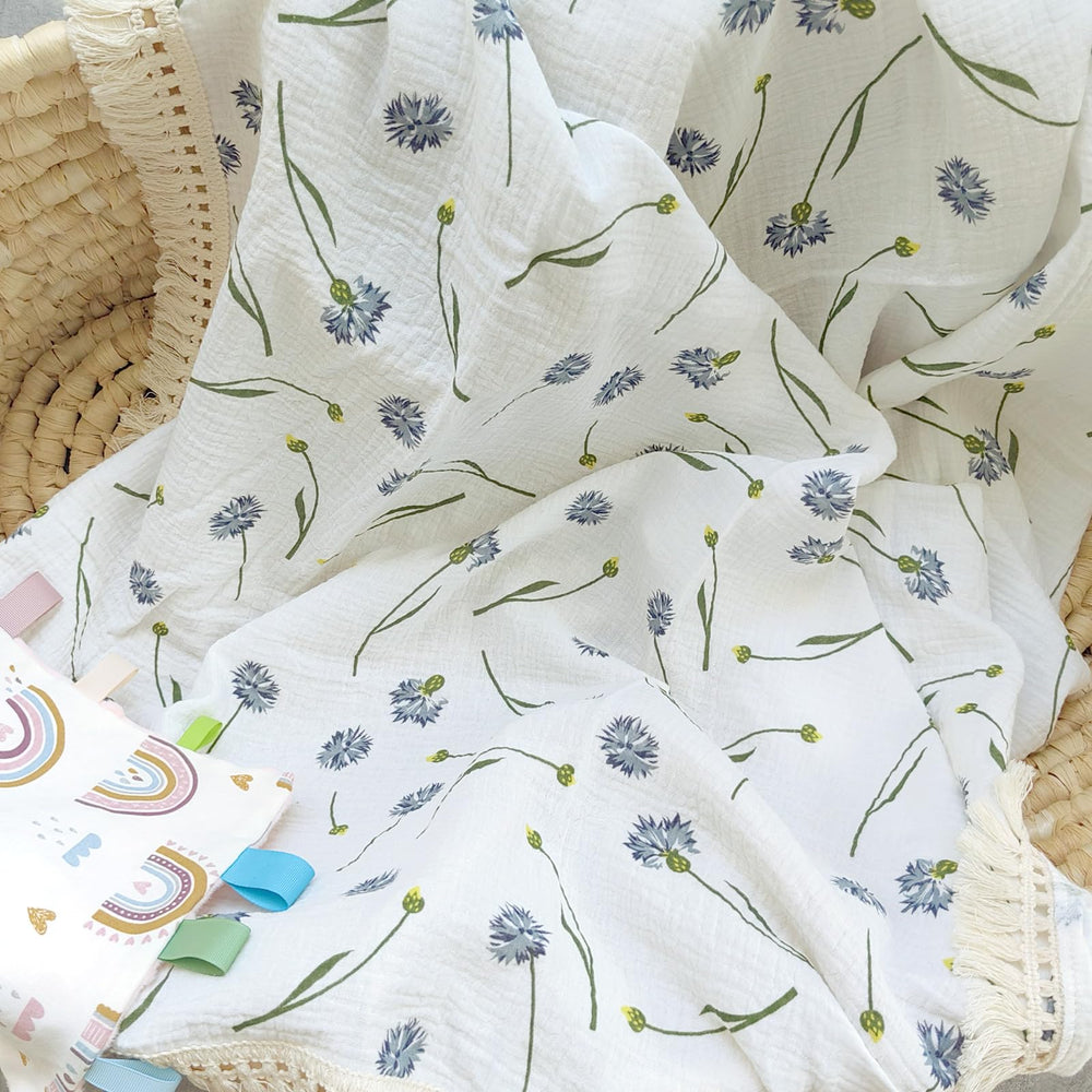 Insular cotton muslin blanket blue dandelion 47x40 measure highlights generous swaddling area.