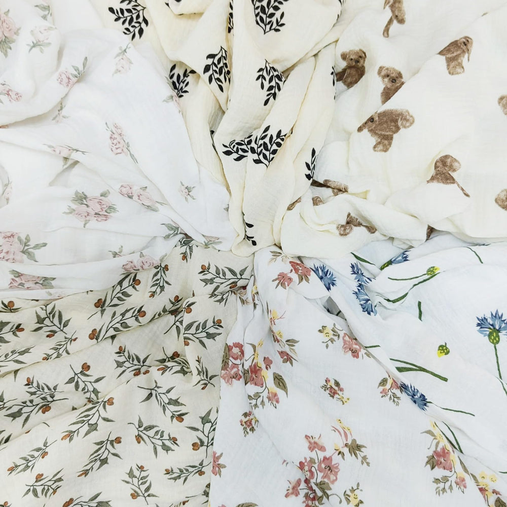 Insular blanket blue dandelion fabric texture suggests breathable, kid-friendly comfort for all-day wear.