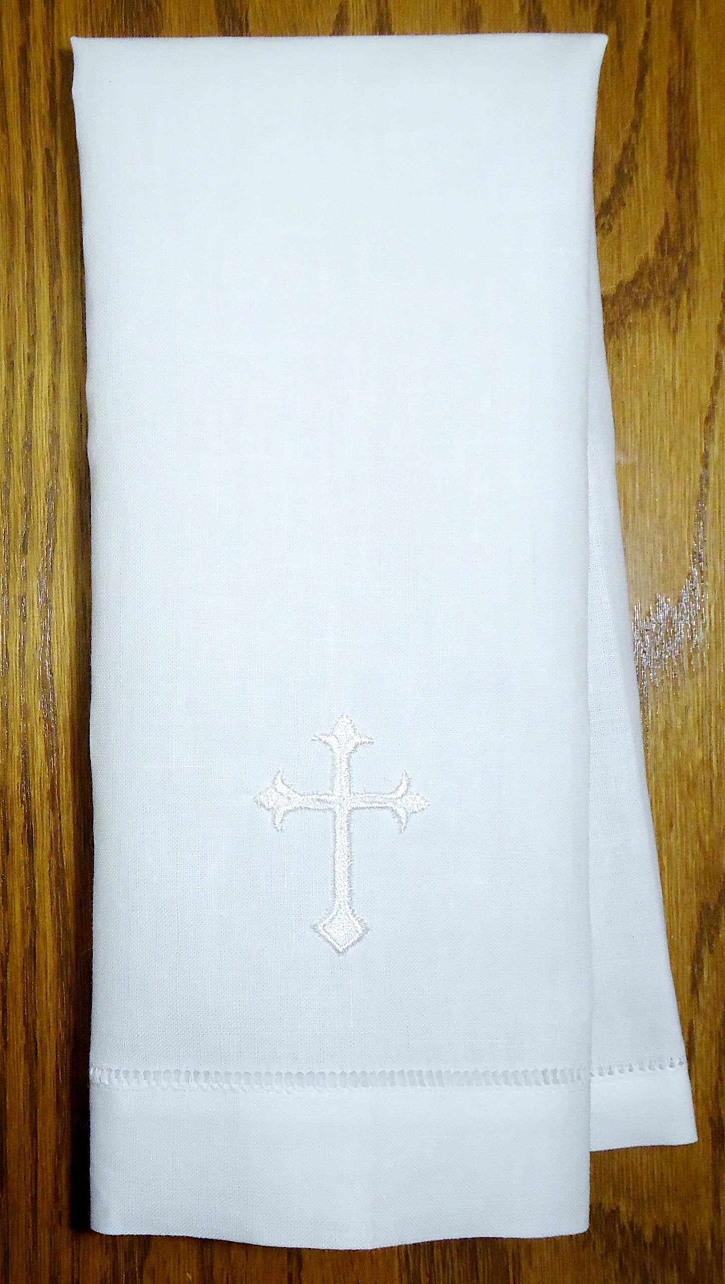 Integrity Designs white linen baptism cloth centers a cross, ideal for baptism ceremonies and bread tray covers.
