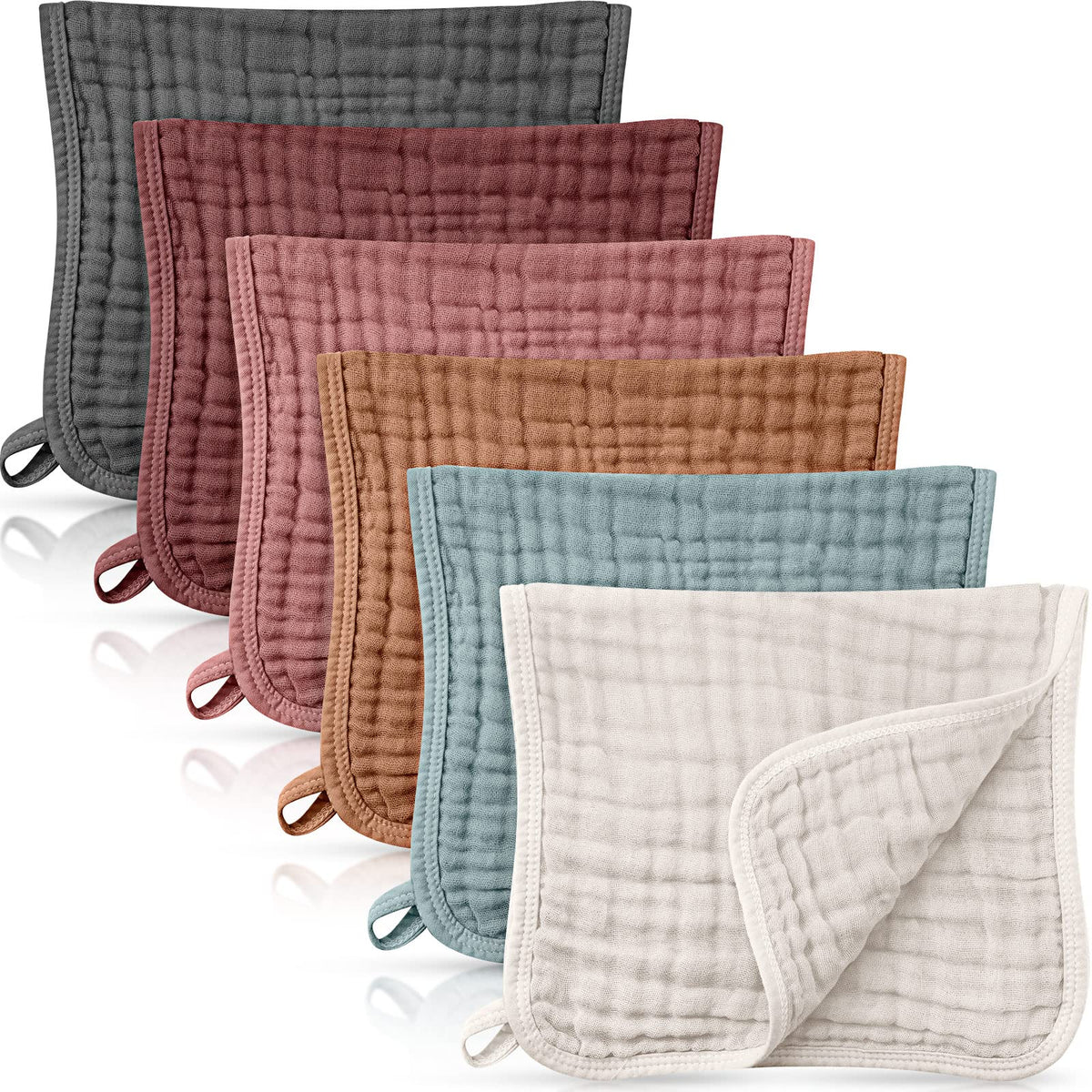 Irenare muslin burp cloths folded neatly showing soft cotton texture and multi-use practicality.
