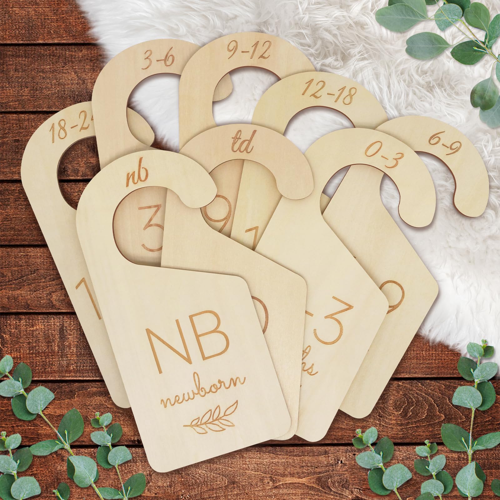 ITDYB newborn-size closet dividers showcase easy wardrobe sorting with warm, natural wood tones.
