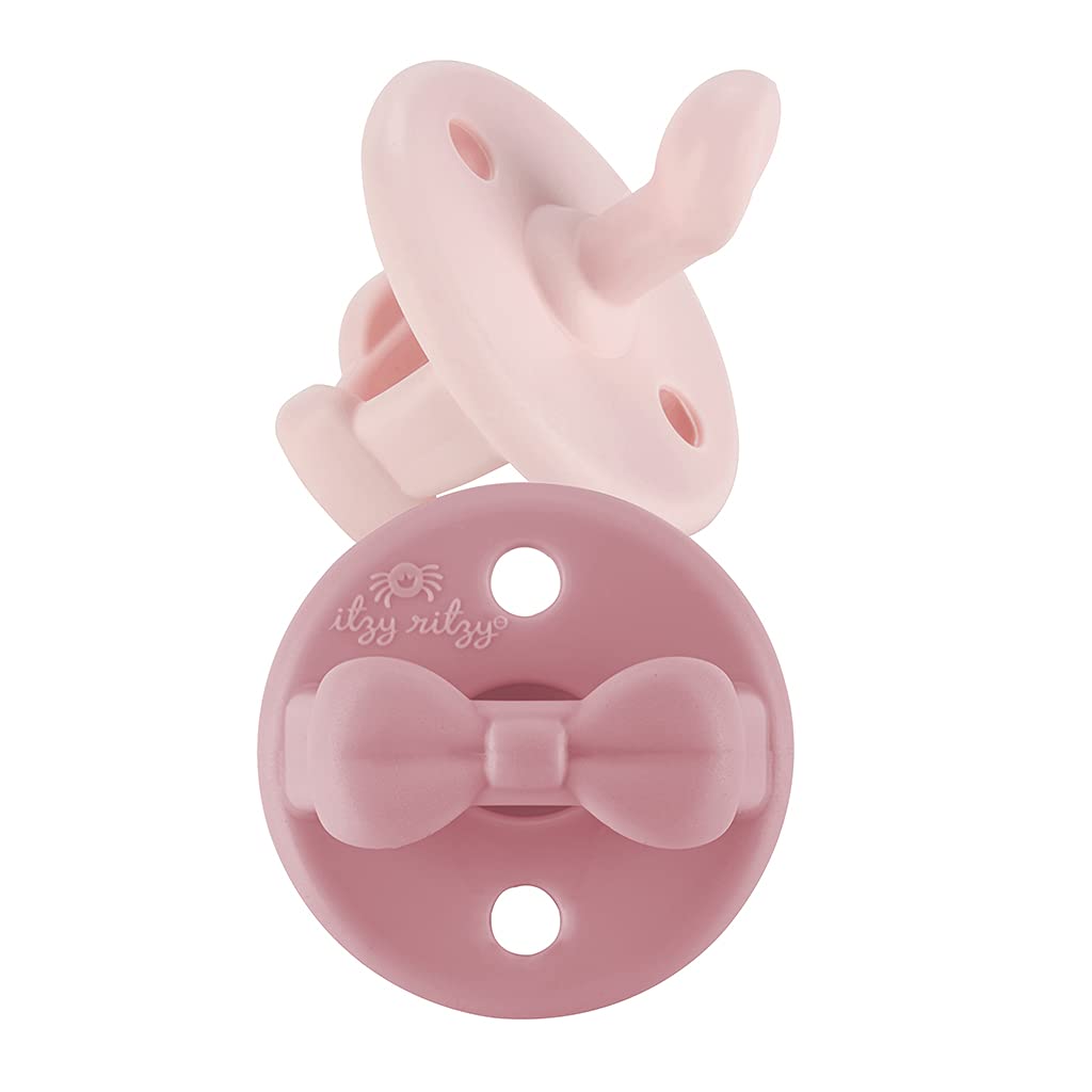 Itzy Ritzy ballet slipper pacifier with orthodontic nipple for gentle gum relief.