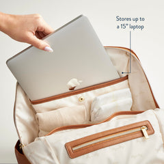 Itzy Ritzy Eras Diaper Bag Backpack changing pad pocket enables quick, clean diaper changes anywhere.