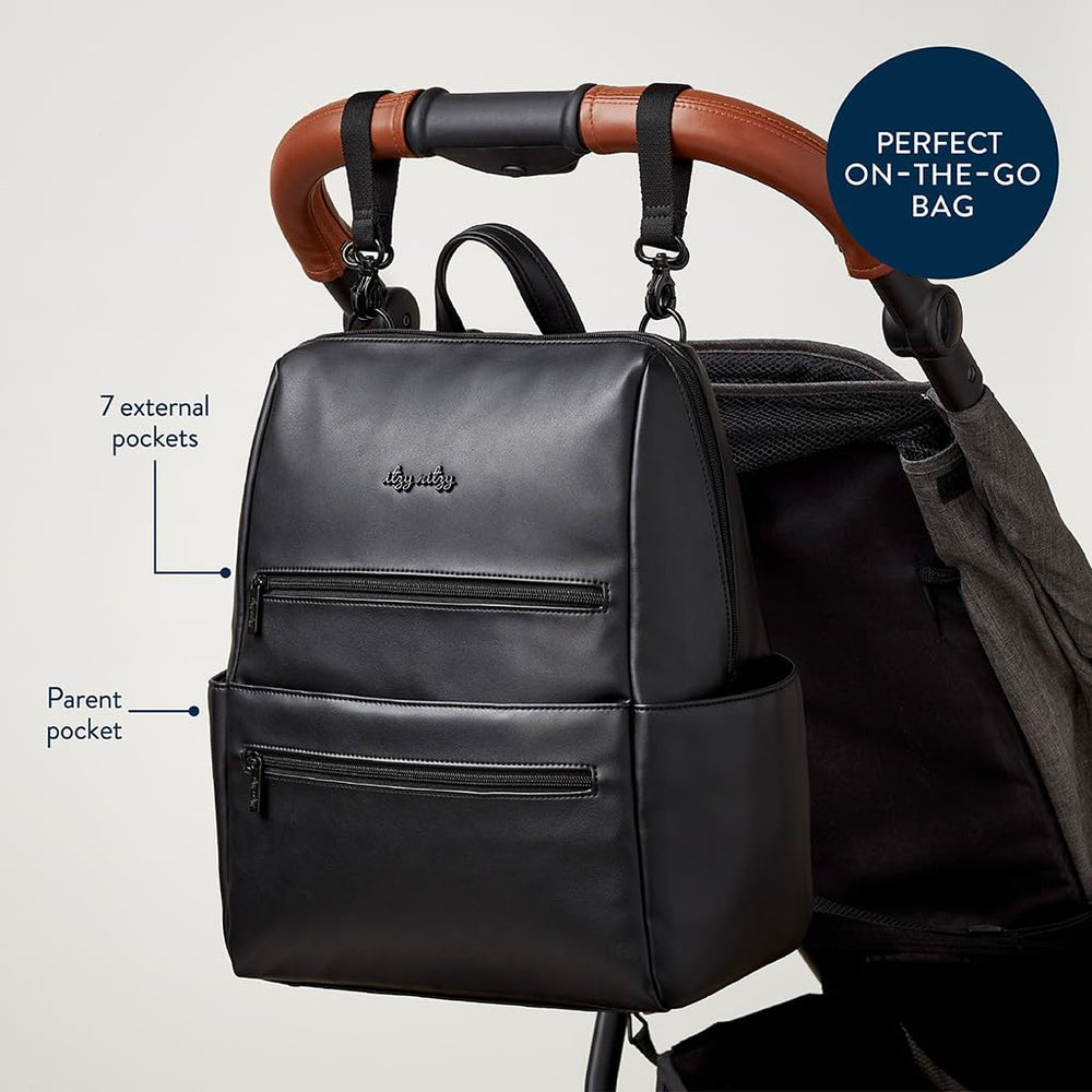 Itzy Ritzy Eras Diaper Bag Backpack stroller straps support hands-free outings.