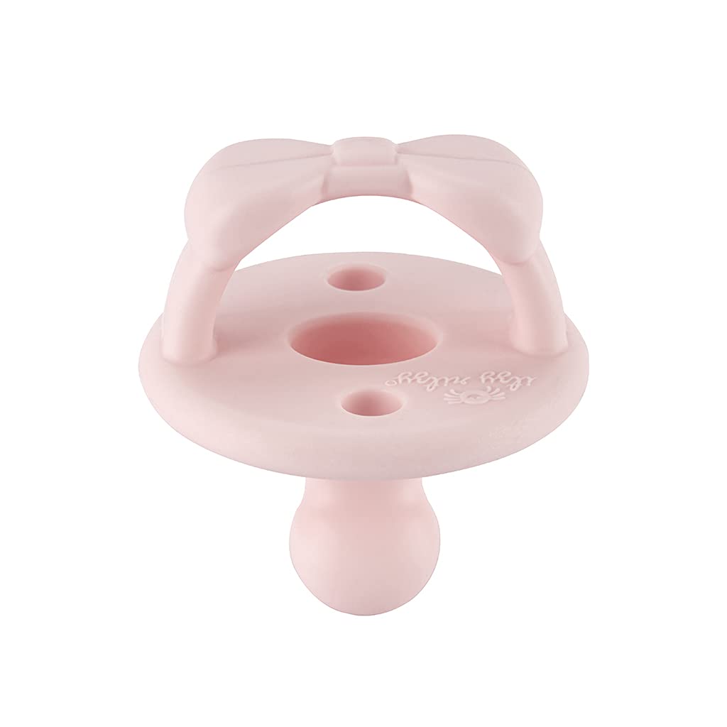Itzy Ritzy primrose pacifier coordinates outfits while soothing during feeds.