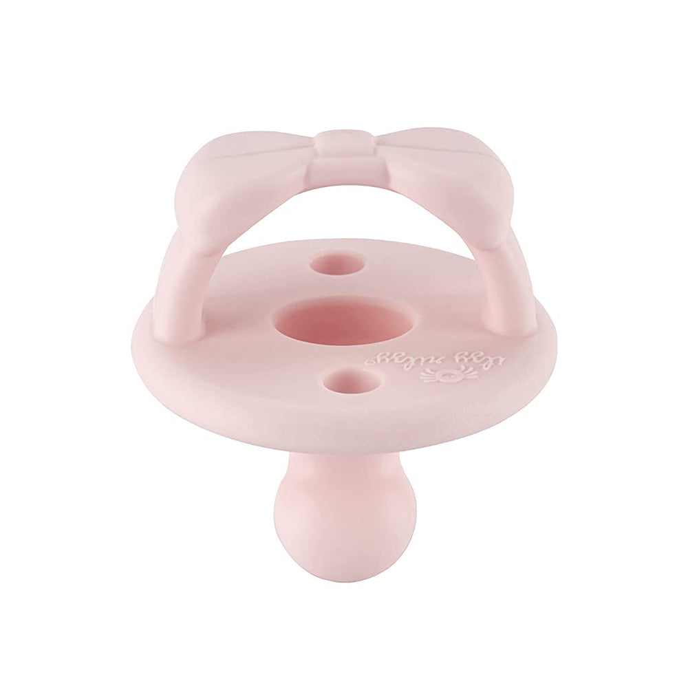 Itzy Ritzy primrose pacifier coordinates outfits while soothing during feeds.