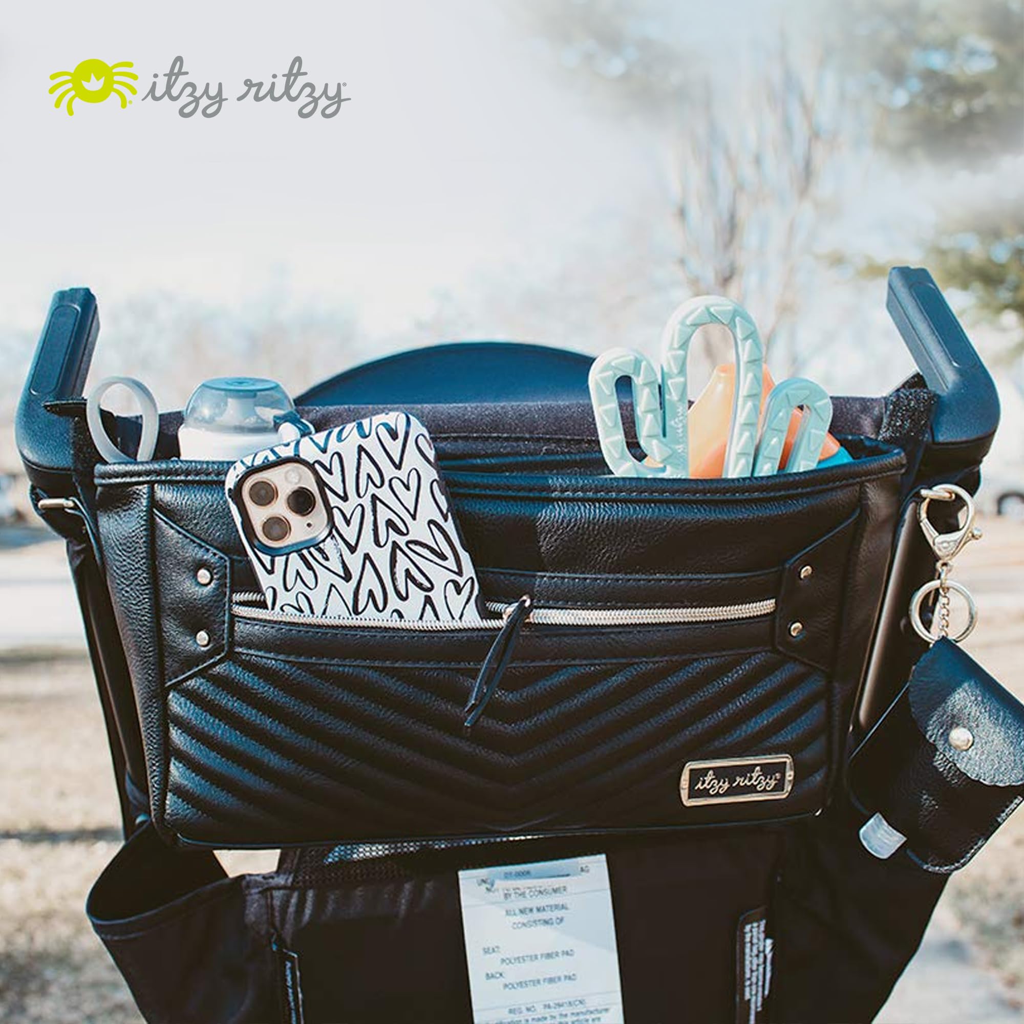 Itzy Ritzy bottle pockets simplify feeding during park visits.