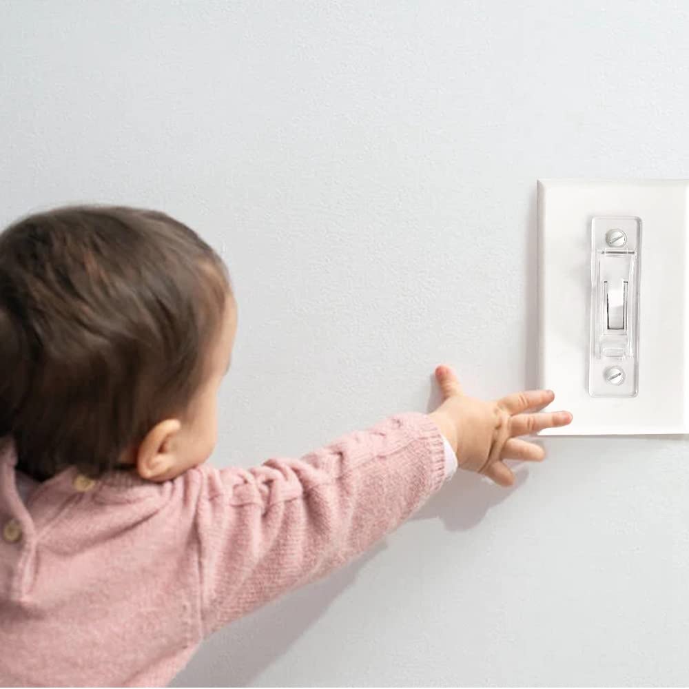ILIVABLE child-proof toggle guard in use during family time shows preventive safety benefits.