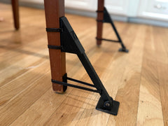 Jackaroo Leg Classic attached to a chair leg demonstrates improved stability.