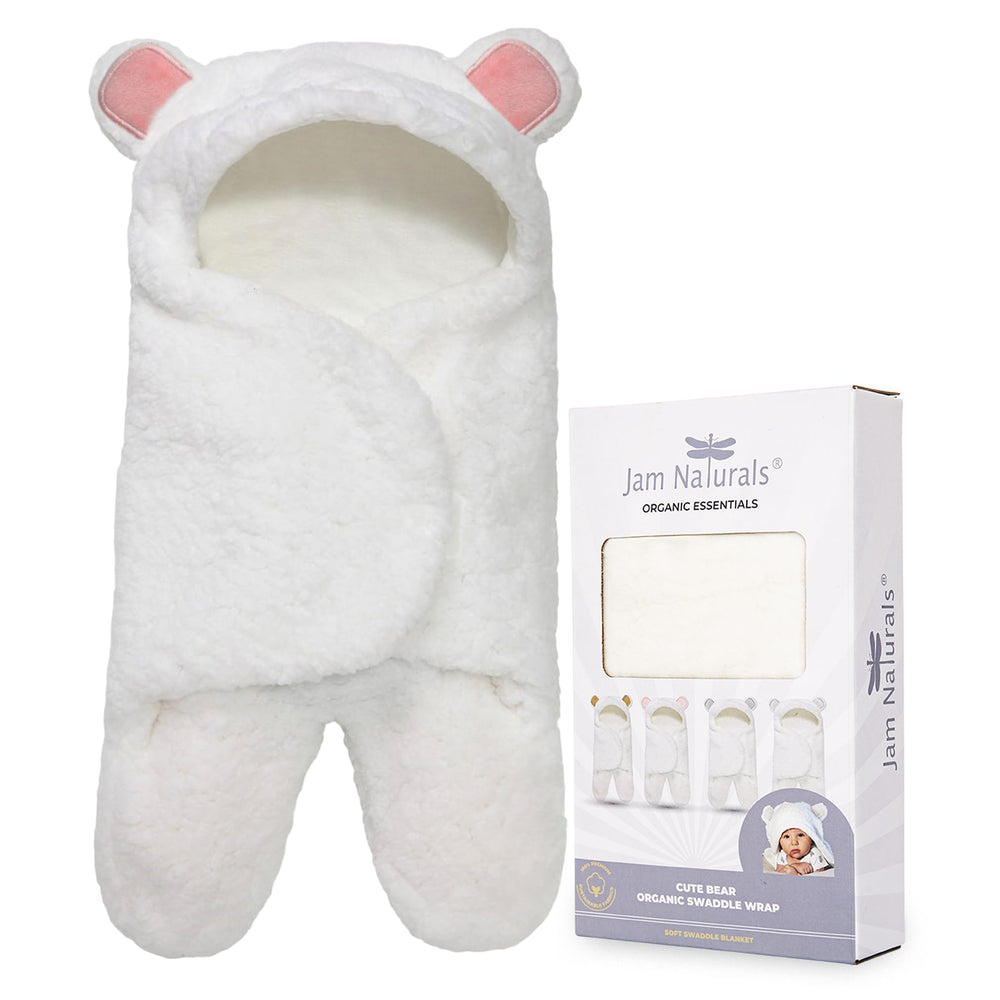 Jam Naturals baby swaddle blanket pink fabric closeup shows ultra-soft texture for gentle skin comfort.