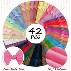 Janinka 4-inch bow headbands frame tiny smiles with a classic, cute knot.