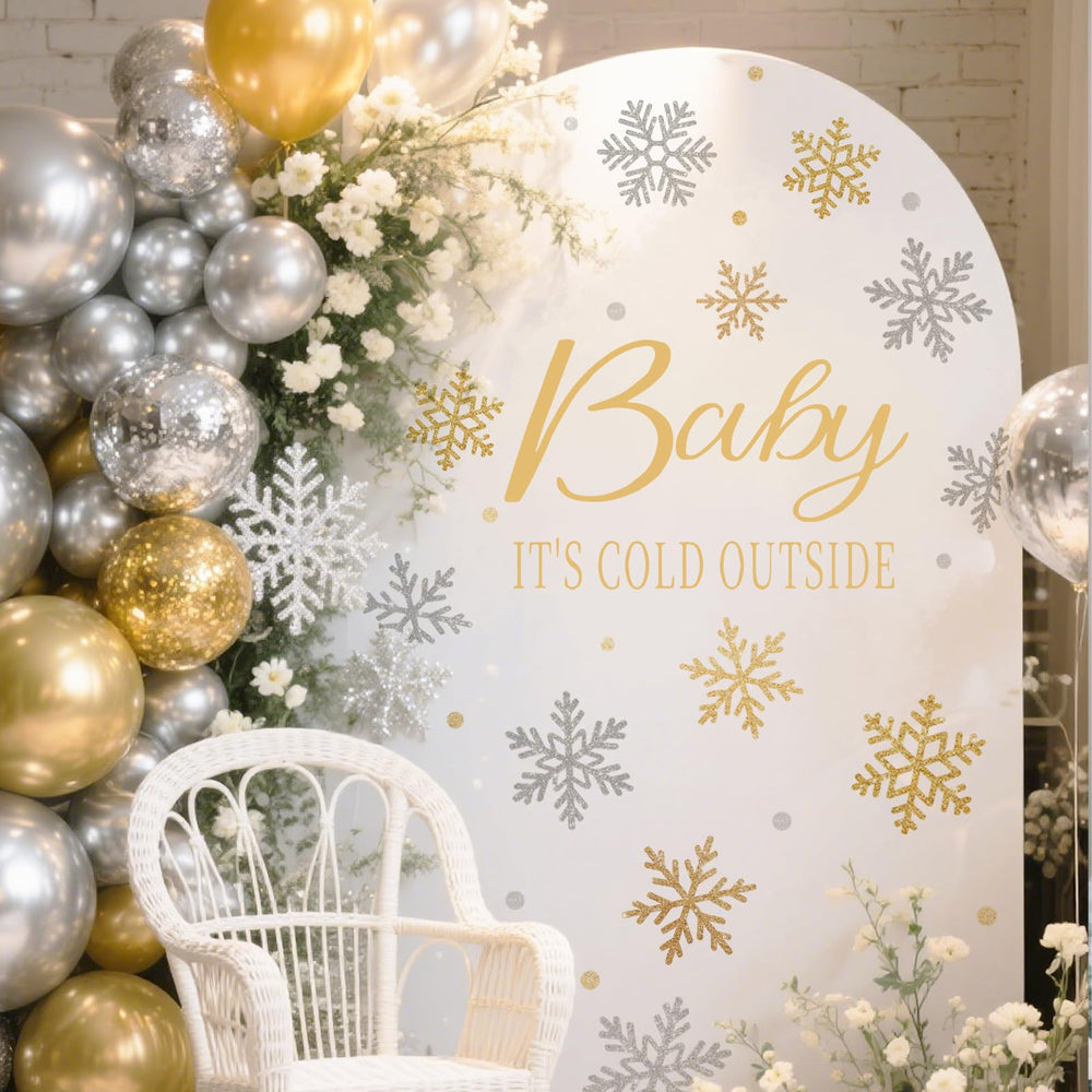 JarThenaAMCS Baby It's Cold Outside decal arch adds festive romance.