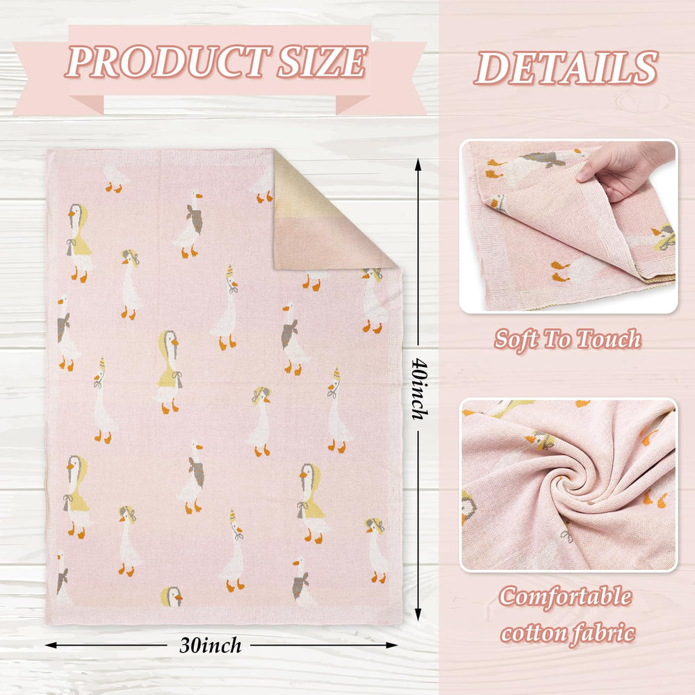 JarThenaAMCS cartoon goose pattern knit blanket pink close-up highlighting playful design and soft touch.