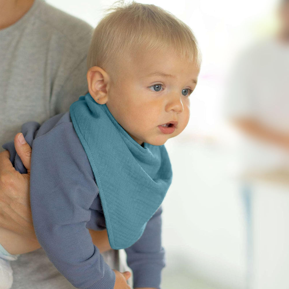 JELLYMONI bibs on a baby during mealtime demonstrating drool protection