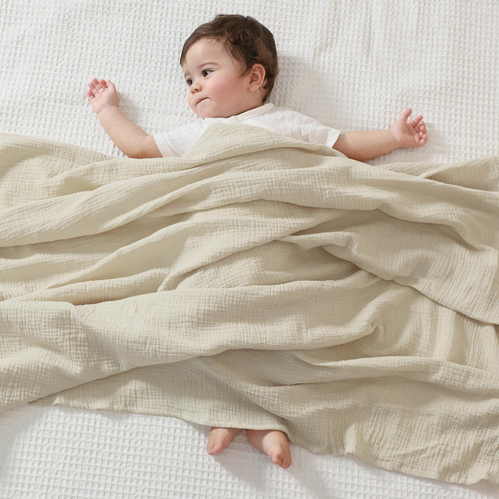 JELLYMONI Muslin Swaddle Blanket large 47x47 image shows generous coverage for secure swaddling.