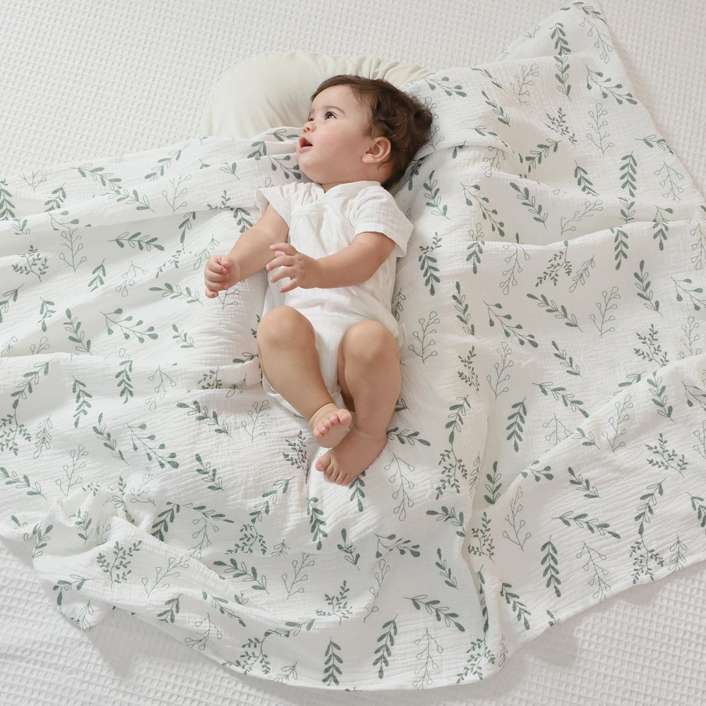 JELLYMONI swaddle blanket close-up shows soft, breathable muslin for gentle baby skin.