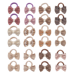 JESSCAT 24pcs baby hair ties with bows ready for ponytails, offering gentle hold for delicate infant hair.