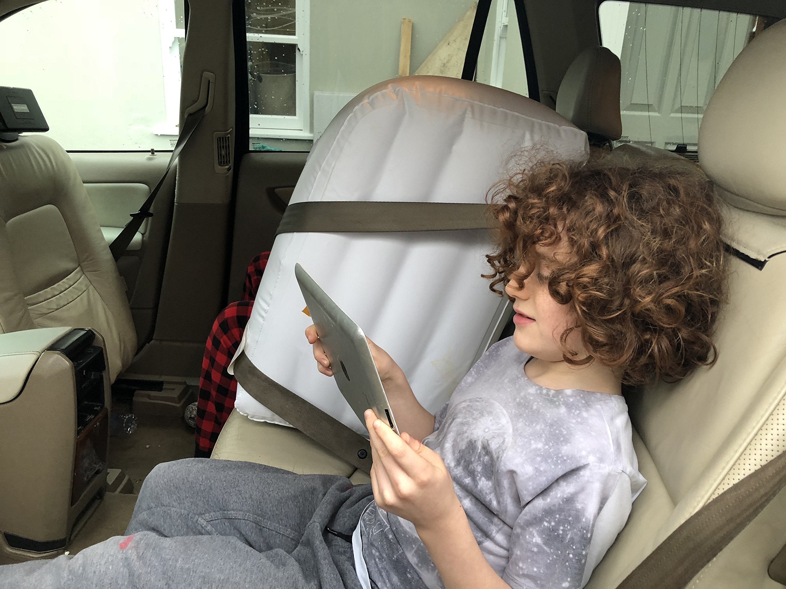 Jet Creations backseat divider separates pets during travel.