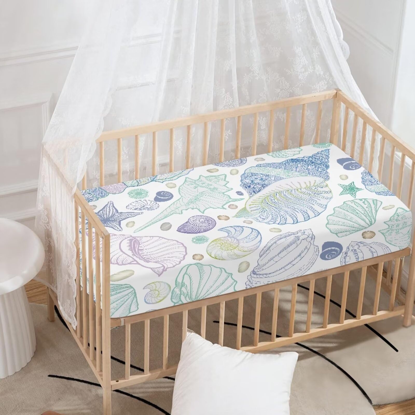 Starfish pattern on a JIANADAER crib sheet adds ocean-inspired nursery style.
