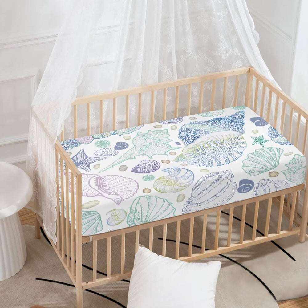 Starfish pattern on a JIANADAER crib sheet adds ocean-inspired nursery style.