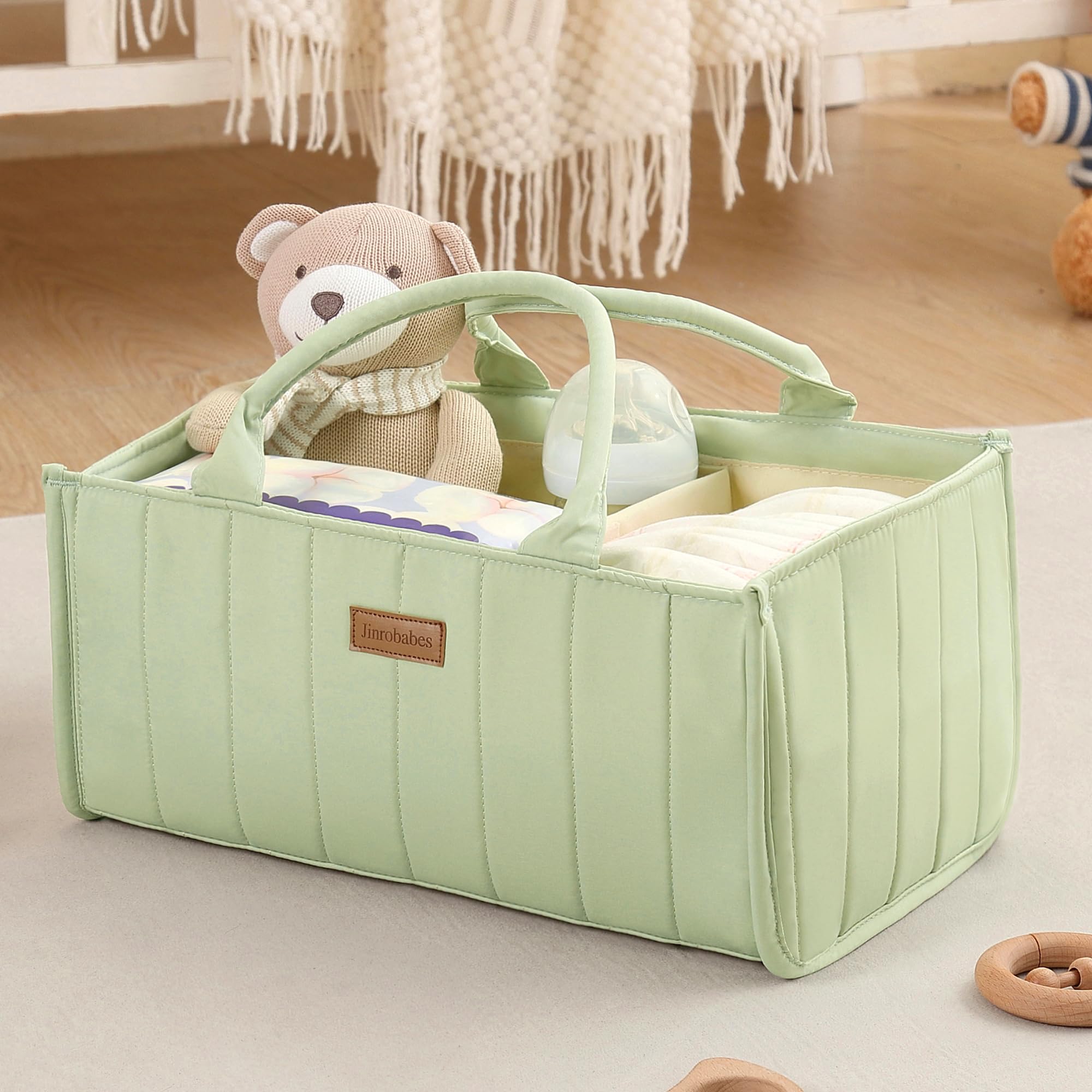 Jinrobabes diaper caddy organizer with multiple compartments keeps diapers and wipes within easy reach.