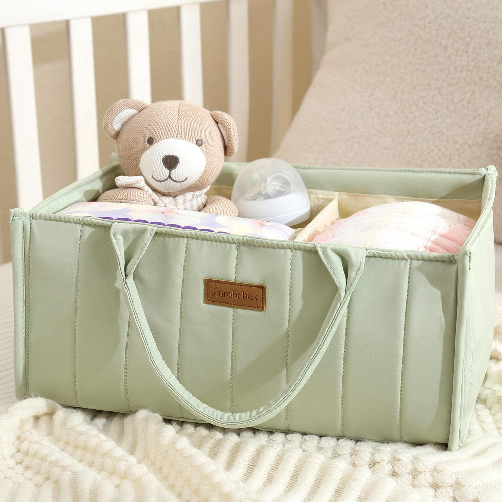 Jinrobabes diaper caddy filled with mom and baby necessities for a tidy changing corner.