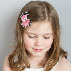 Jissoo cow print bow headband flat lay, cute rustic style complements any outfit.