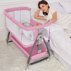 Jixrolyn pink bassinet standalone crib offers a compact newborn sleep space.