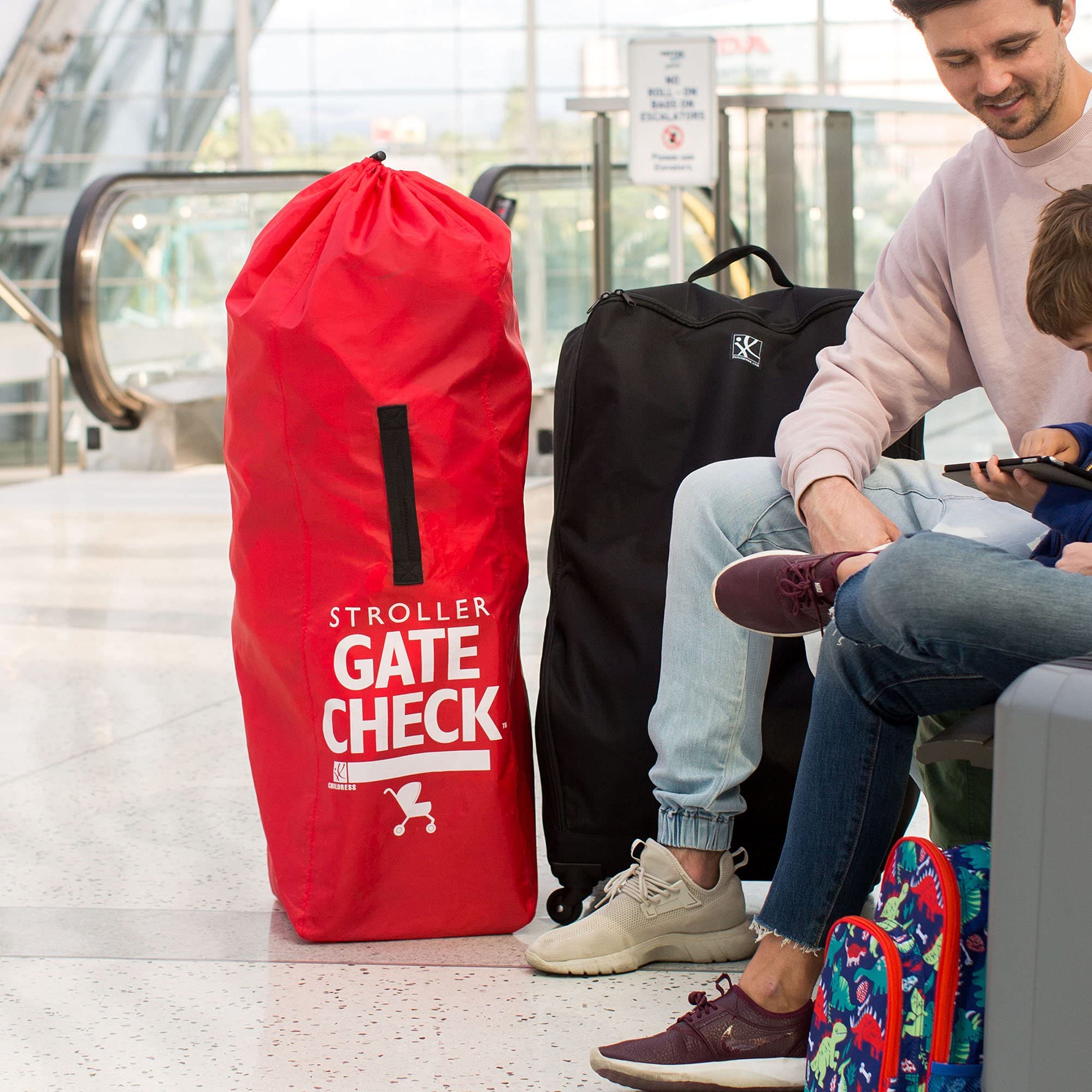J.L. Childress gate check bag durable polyester resists travel wear.