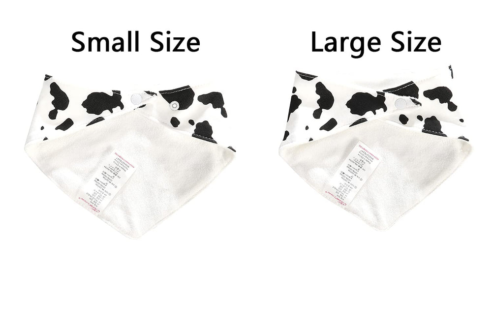 JN&LULU cow-pattern bibs worn by baby during play.