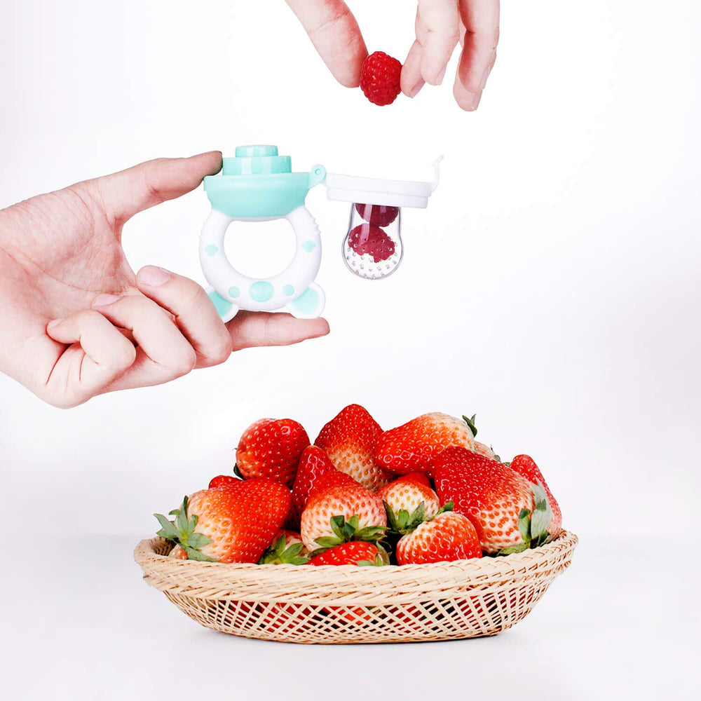 Jochebed cyan feeder with comfortable grip for little hands during meals.