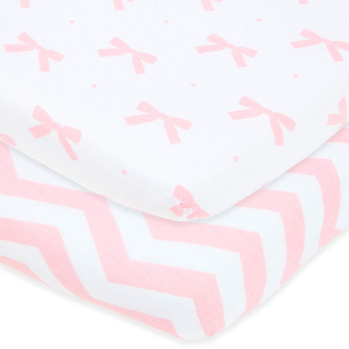 Joey + Joan pink bassinet sheet on 20x30 mattress showing jersey cotton softness for baby comfort.